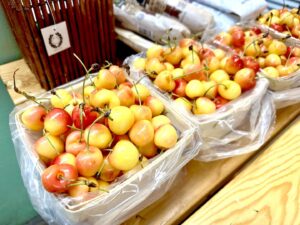farmer – NRH Farmers Market – Rainier cherries are in season now.