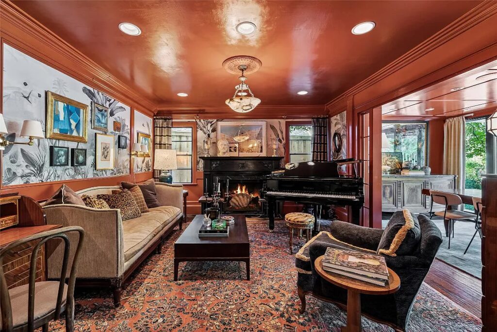 A warm, wallpapered living area. 