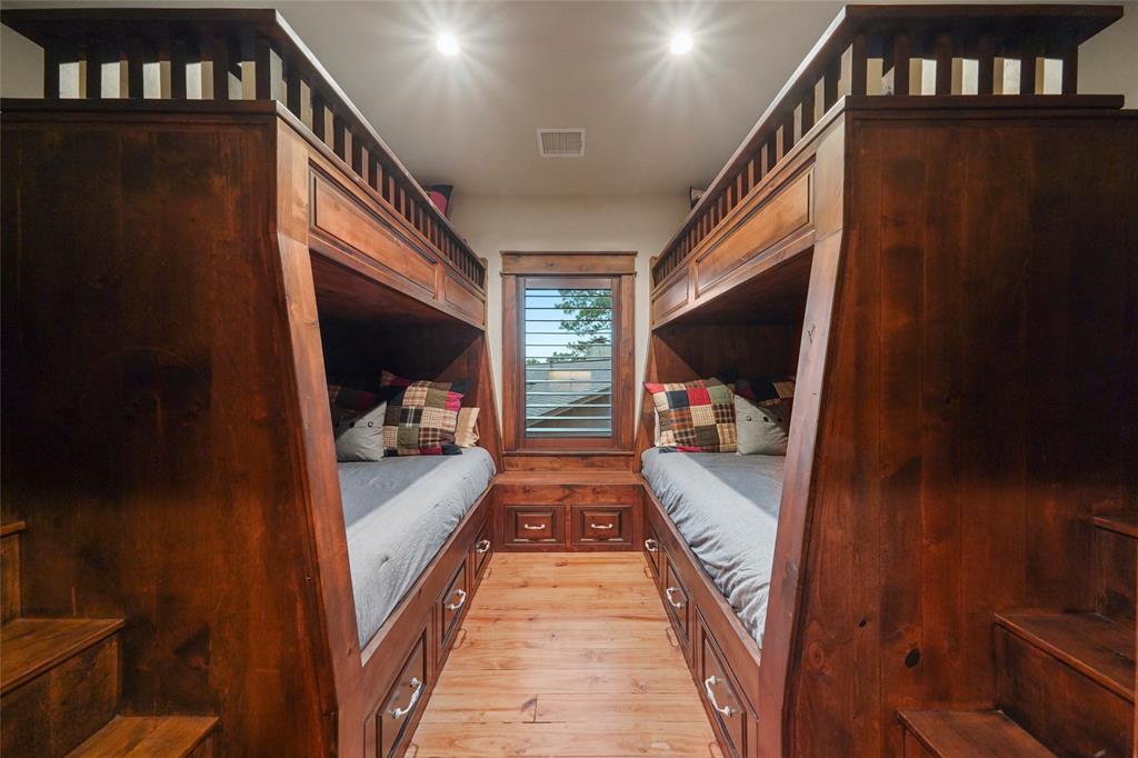 Charming bunk beds at 9144 Escondido Drive on Lake Conroe. (Photo by EmoMedia/Compass)