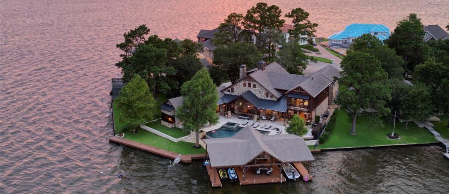 The waterfront home at 9144 Escondido Drive on Lake Conroe was designed by architect Mark Todd and is listed for sale with Compass.(Photo by EmoMedia/Compass)