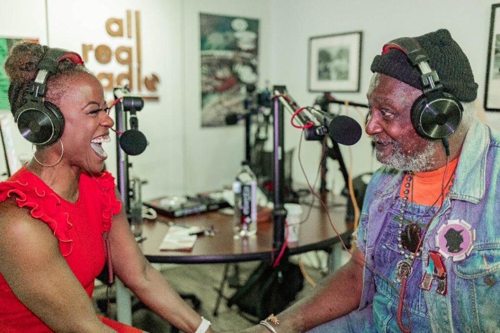 Project Row Houses executive director Eureka Gilkey interviews Project Row Houses co-founder and artist Jesse Lott in the All Real Radio studio at Project Row Houses. (Photo by Wando Okongwu, courtesy Project Row Houses, Houston)