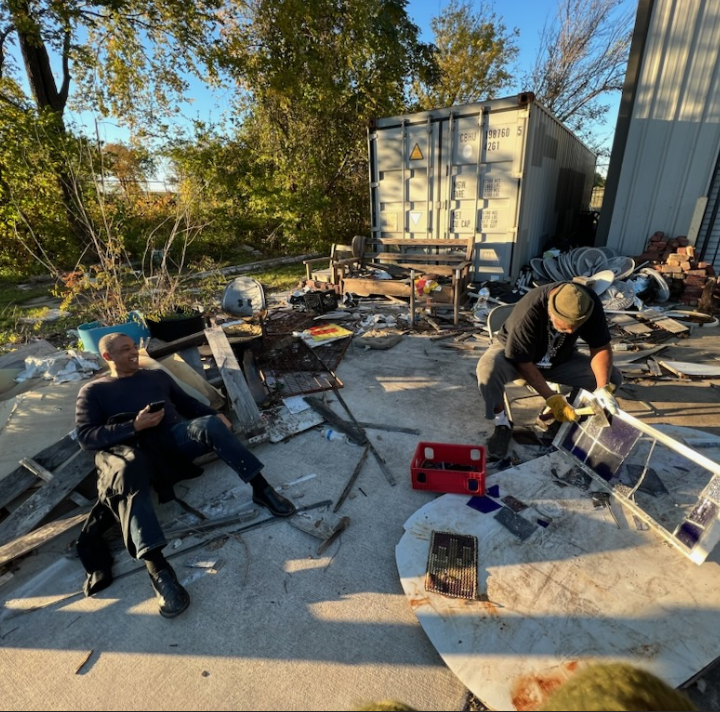 Artists and Project Row Houses co-founders Rick Lowe and Jesse Lott enjoy a moment outside Lott's Fifth Ward studio. (Courtesy Angelbert Metoyer)