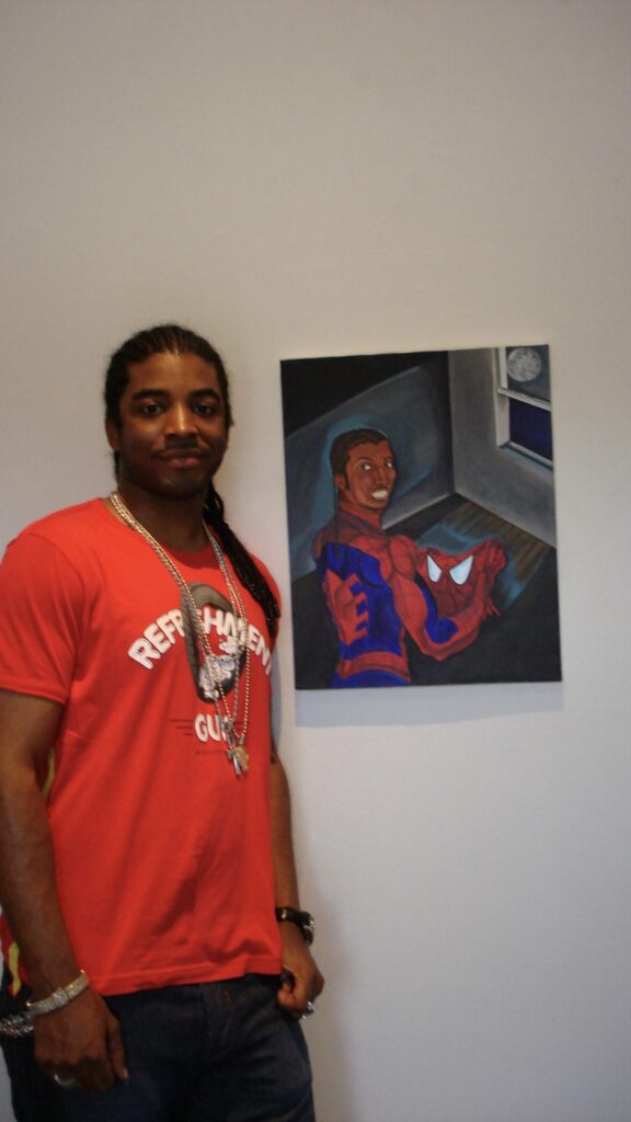 Artist El Franco Lee II stands next to his Spider Man-themed painting "Once In A Blue Moon," 2003. (Courtesy El Franco Lee II)