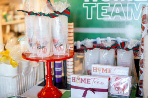 Football season table decorations are in stock at Jen Love Paper with local teams featured.