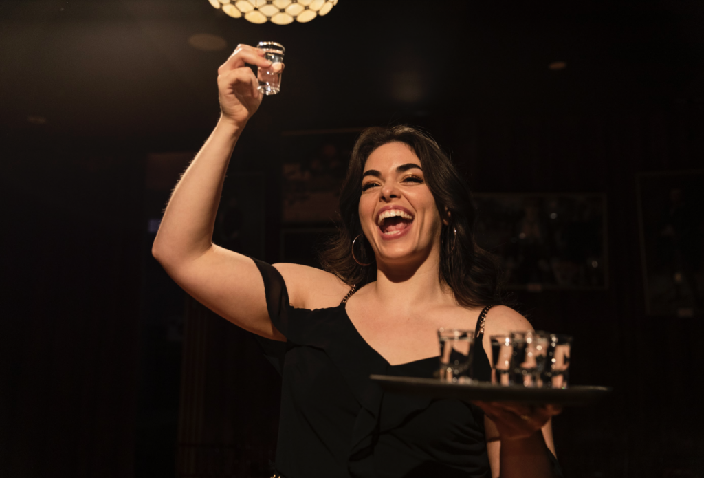 An actor raises a toast to the audience at Houston's Drunk Shakespeare before taking her first shot. (Photo by © Drunk Shakespeare)