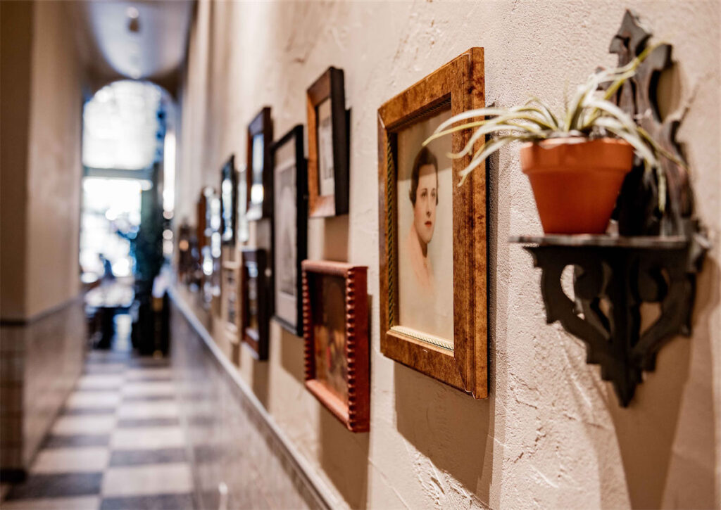 Leigh Hutchison designed the Via Triozzi space to feel familial, featuring several photos of her own family. (Courtesy of Via Triozzi)