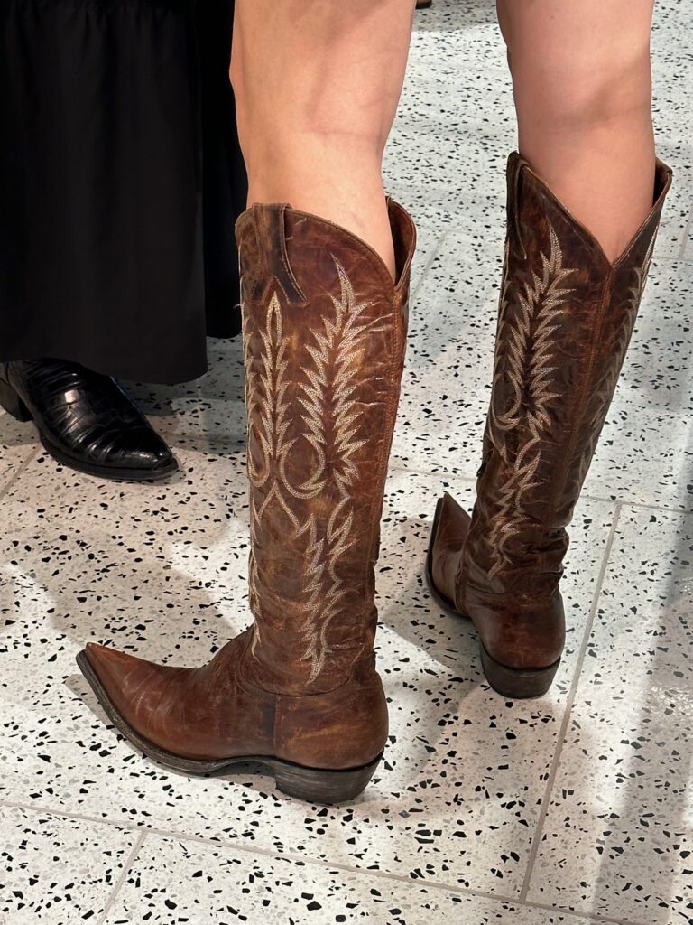 Western boots worn with frocks and shorts were de rigueur  at the Tootsies salute to Pat Mann Phillips, Houston Rodeo's first female board chair. (Photo by Shelby Hodge)