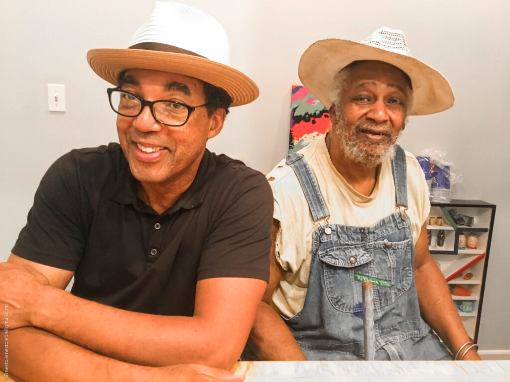 Artists and Project Row Houses co-founders Rick Lowe and the late Jesse Lott share a laugh. Other PRH co-founders include James Bettison, Bert Long Jr., Bert Samples, Floyd Newsum, and George Smith. (Photo by Ernesto Leon)