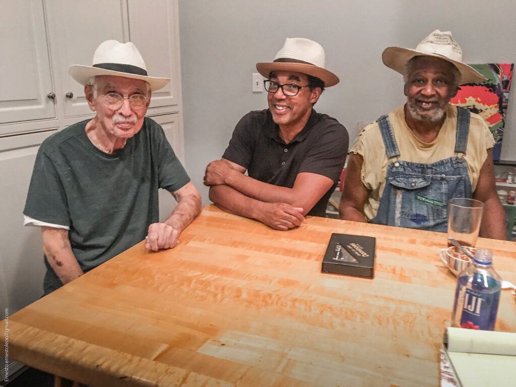 From left: Late Station Museum of Contemporary Art director and curator Jim Harithas, artist and Project Row Houses founding director Rick Lowe, late artist Jesse Lott, a Project Row Houses co-founder. The three often played domino games. (Photo by Ernesto Leon)