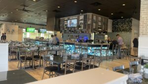 The light and bright interior of Good Charlie’s has booth, table and hightop seating available around seven TV screens.