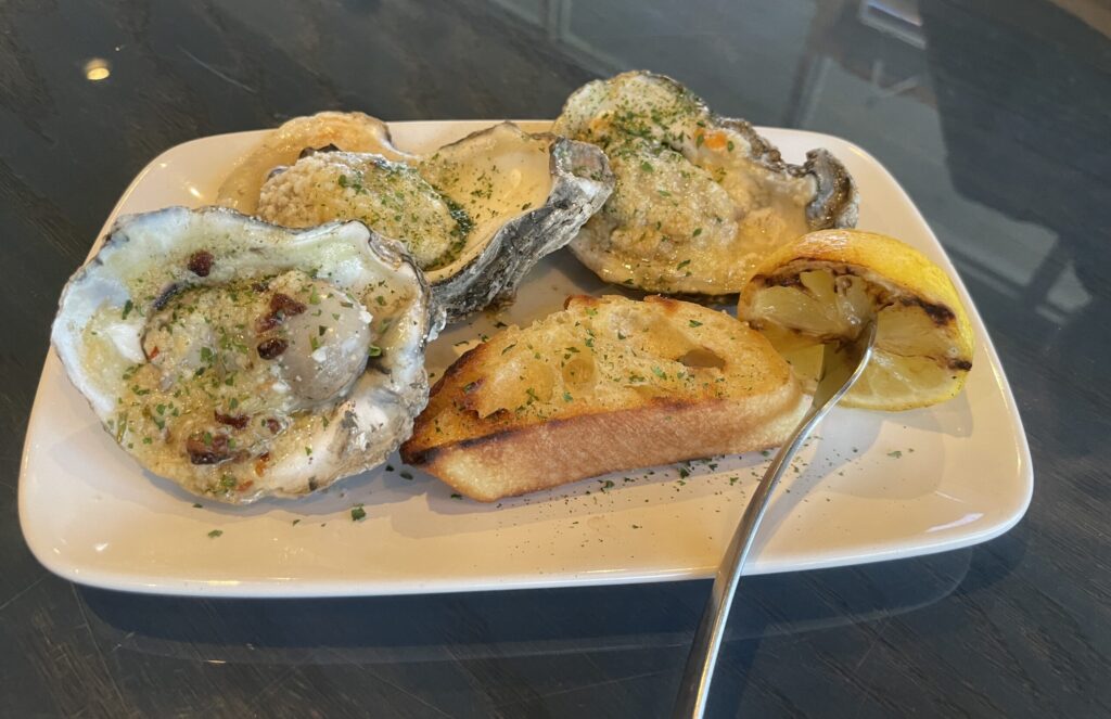 Chargrilled oysters are available in several flavors at Good Charlie's in The Woodlands.