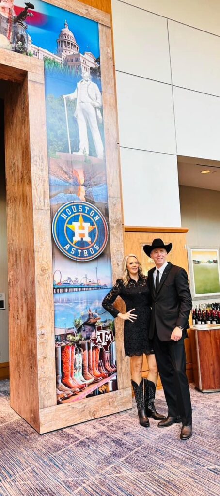 Jim and Leigh Ann Carman get into the cowboy spirit outside the ballroom at the Marriott Waterway.