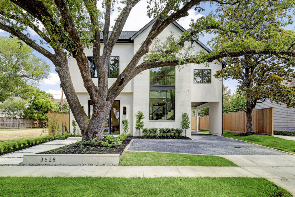 The new build at 3629 Locke Lane in River Oaks is noted not only for its design but also the century oak. (Photo by TK Images for Compass)