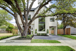 The new build at 3629 Locke Lane in River Oaks is noted not only for its design but also the century oak. (Photo by TK Images for Compass)