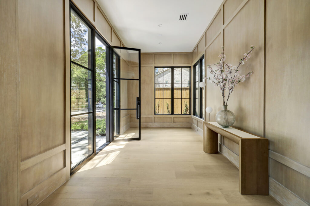 Paneling in the foyer at 3628 Locke Lane adds warmth to the visitor's arrival.  (Photo by TK Images for Compass)