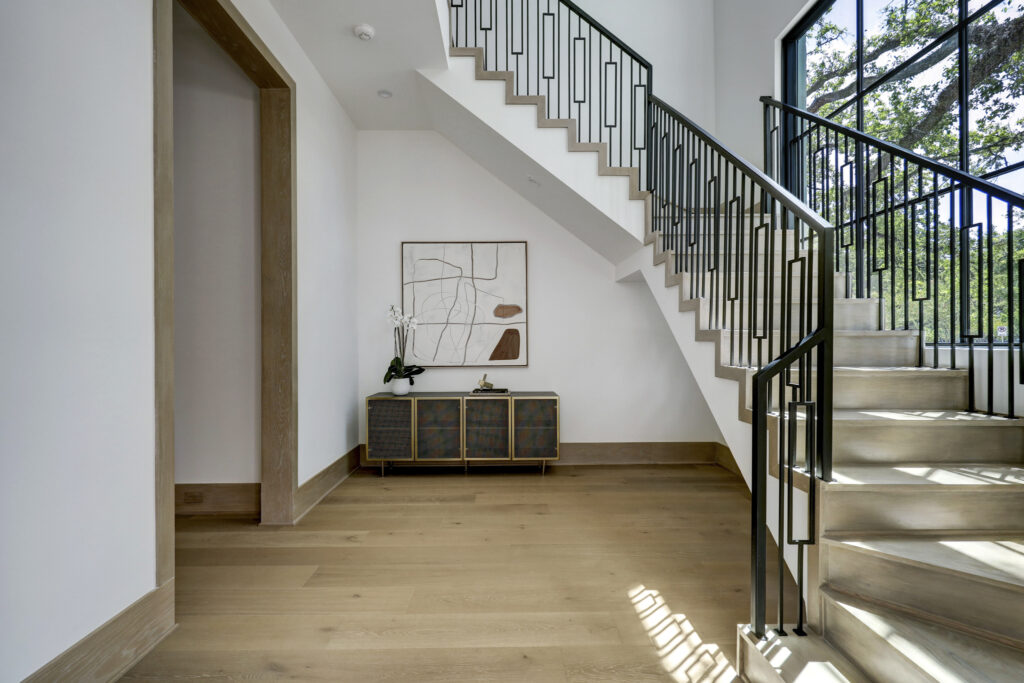 The central stairway at 3628 Locke Lane. (Photo by TK Images for Compass)