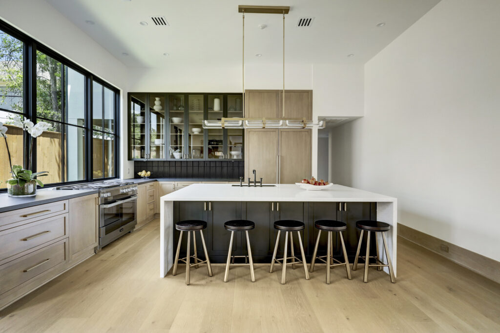 The contemporary kitchen with Miele appliances at 3628 Locke Lane in River Oaks. (Photo by TK Images for Compass)