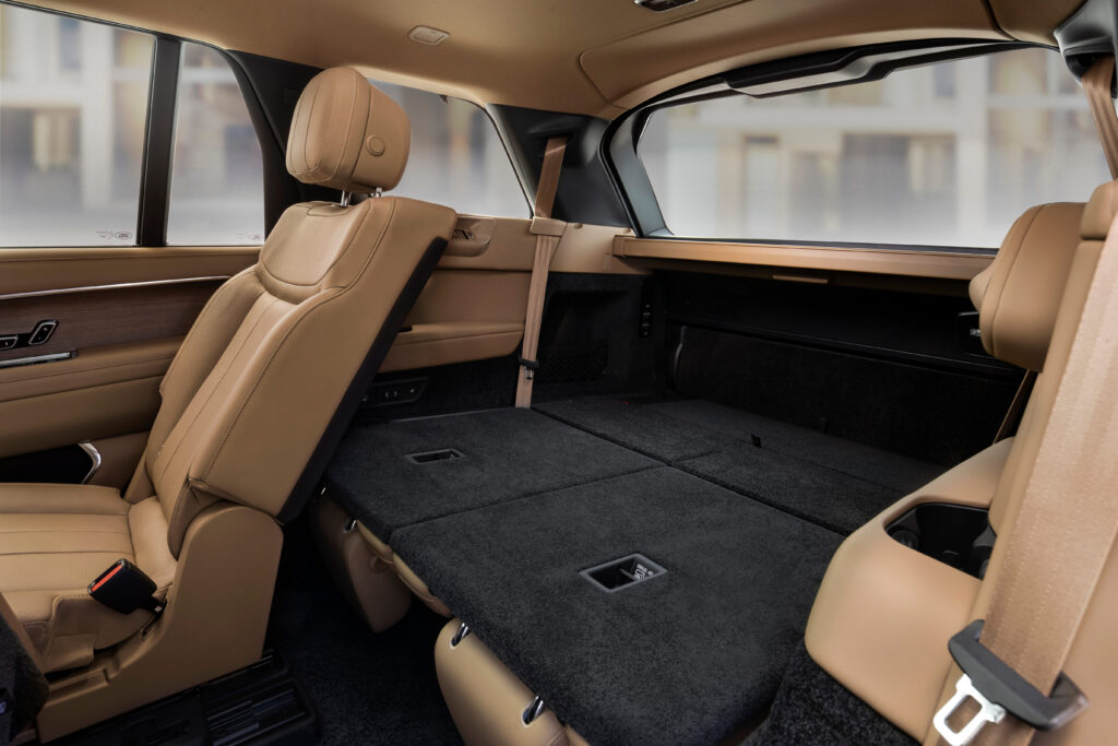 Back in the third row, accommodations are generous, complemented by cupholders, USB-C ports, and both A/C vents and heated seats. Finally, a dual-position cargo cover that expands to shield the two rearmost rows is a much-welcomed accessory. (Courtesy Land Rover)
