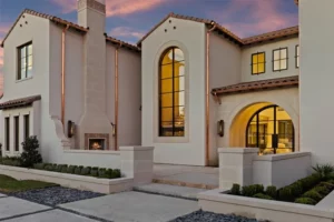 Six – 7239 Oak Valley – a modern entrance with a front courtyard and outdoor fireplace