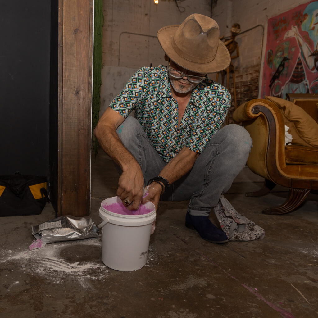 Artist Patrick Medrano prepares the silicone rubber for the casting. (Photo by Katy Anderson)