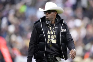 TCU – Deion Sanders will stoll onto Amon G Carter Stadium, debuting as a college head coach for Colorado. (Photo by David Zalubowski – AP File)