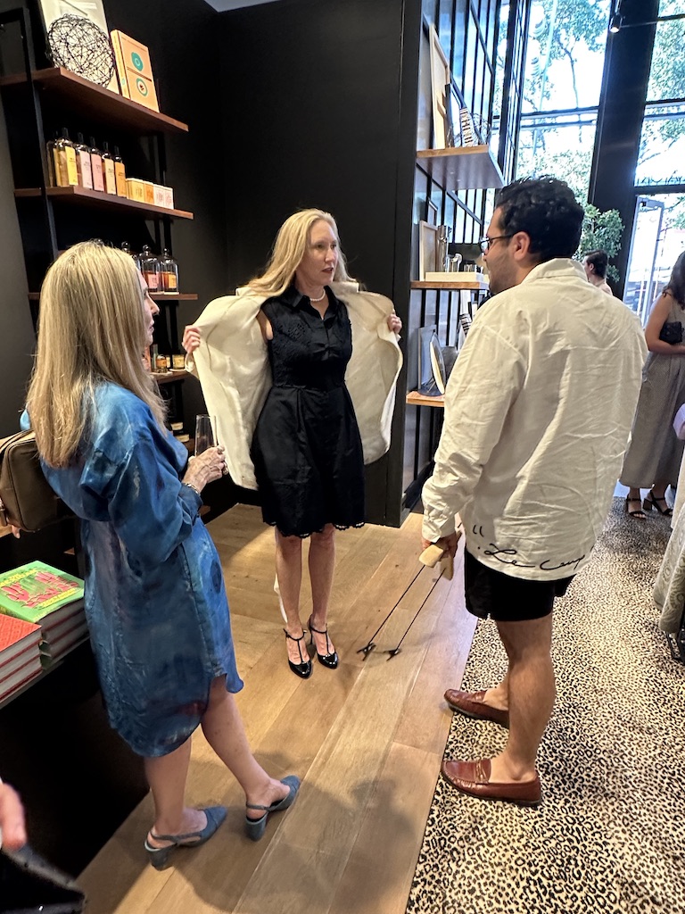 Designer Amir Taghi discusses his creations with clients at The Conservatory in River Oaks District.