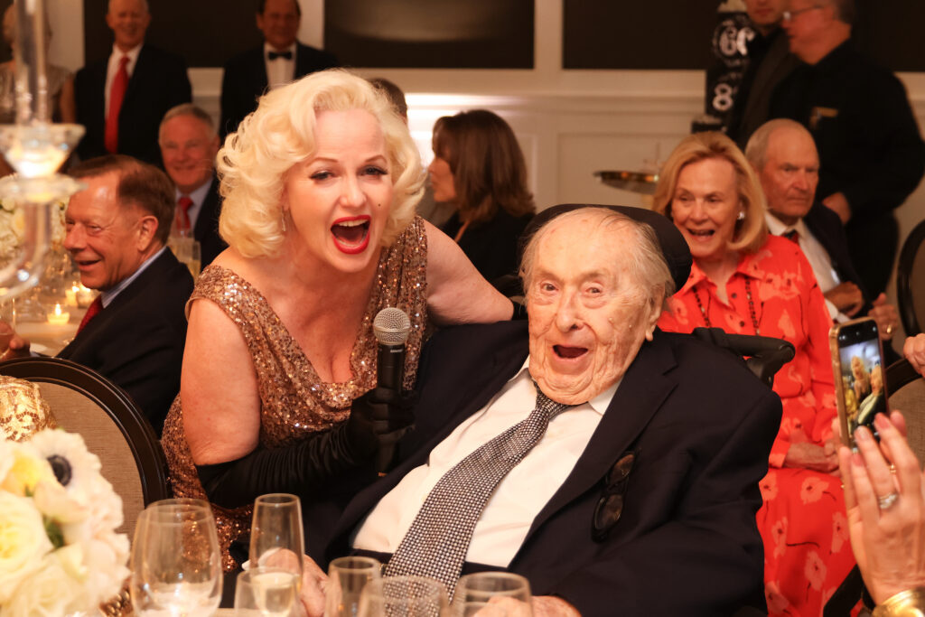 'Marilyn Monroe' delights the birthday boy at the Lynn & Oscar Wyatt birthday/wedding anniversary celebration at the Houston Petroleum Club. (Photo by Priscilla  Dickson)