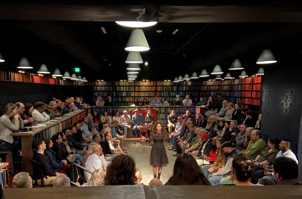 Anastasia Zavitsanos conjures the spirits during a magical monologue at Houston's Drunk Shakespeare. (Photo by © Drunk Shakespeare)