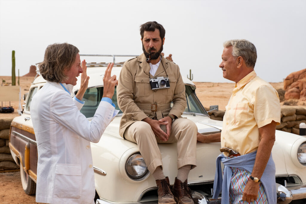 Wes Anderson, Jason Schwartzman, and Tom Hanks on the set of "Asteroid City." ("Asteroid City" images courtesy of Roger Do Minh/Pop. 87 Productions/Focus Features)