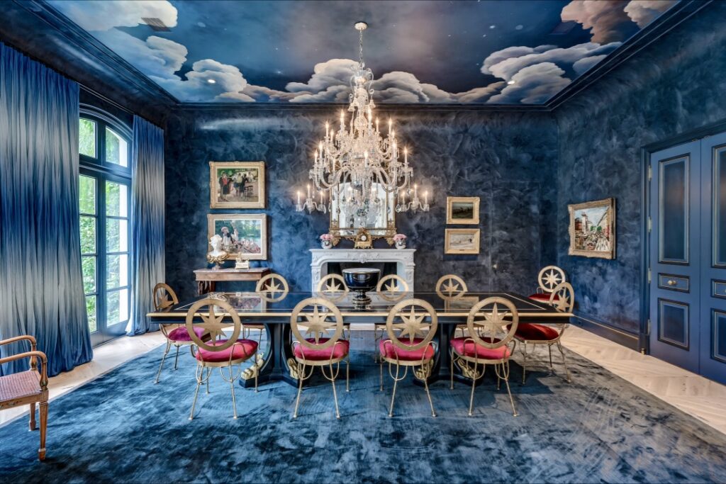The hand-painted ceiling sets the stage for the dramatic dining room with its Baccarat chandelier. (Photo by Patrick Bertolino for Martha Turner Sotheby’s International Realty)