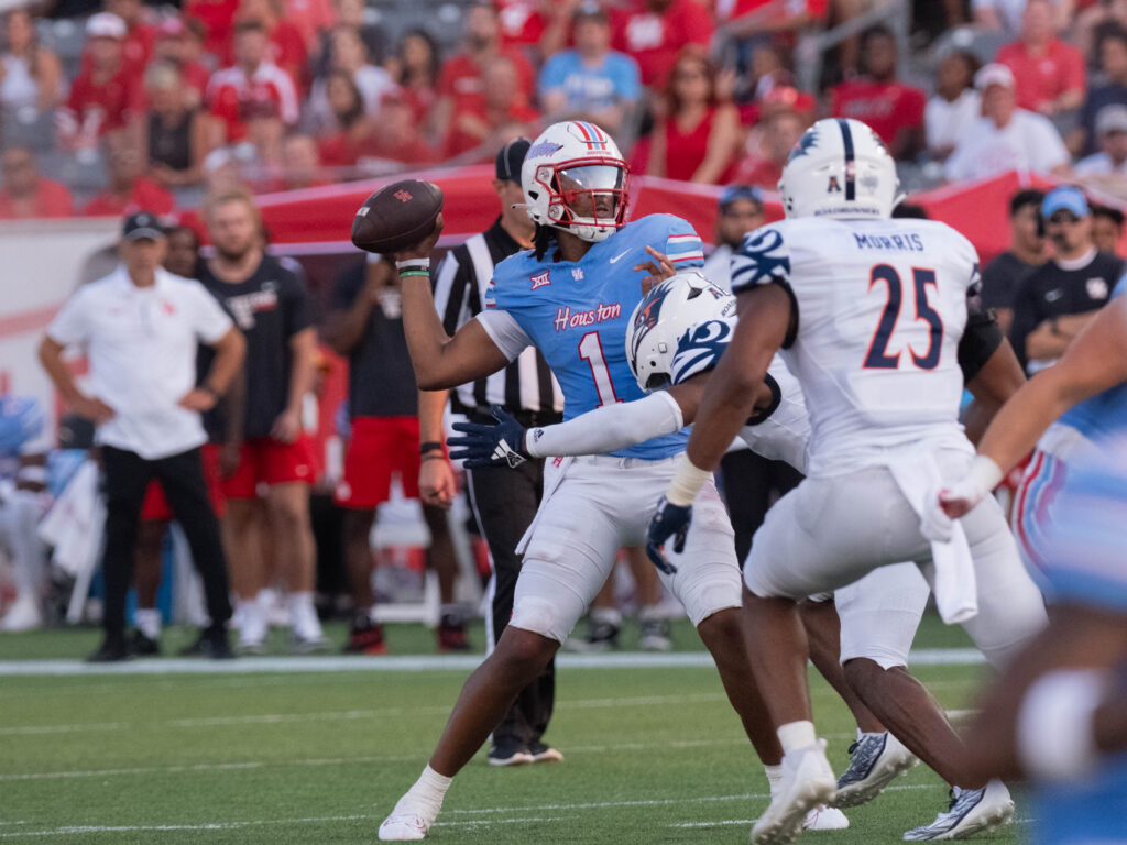 University of Houston quarterback Donovan Smith isn't afraid to stand in there and take a hit. (Photo by F. Carter Smith)