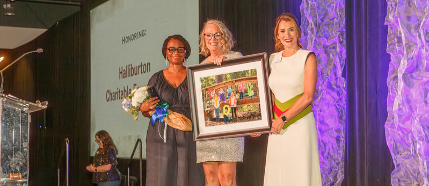 Corporate sponsor Halliburton was recognized at the gala by board chairman Michelle Little (r) and MG Tindall at the Denim and Diamonds gala