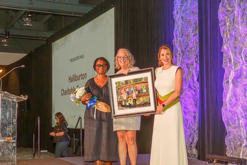 Corporate sponsor Halliburton was recognized at the gala by board chairman Michelle Little (r) and MG Tindall at the Denim and Diamonds gala