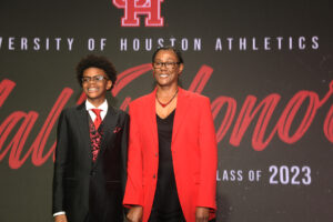 Sandra Cummings Glover looks good in her red UH Hall of Honor jacket. (Photo by Eddy Matchette/Courtesy UH Athletics)