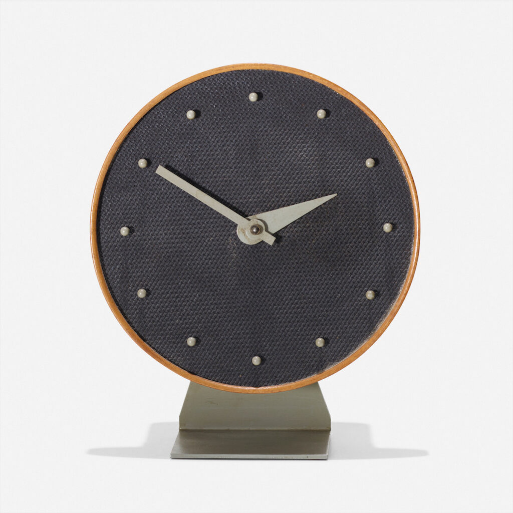 George Nelson and Associates Masonite table clock, model 4767A, 1949 (lacquered wood, Masonite, walnut, enameled steel, enameled aluminum) 
