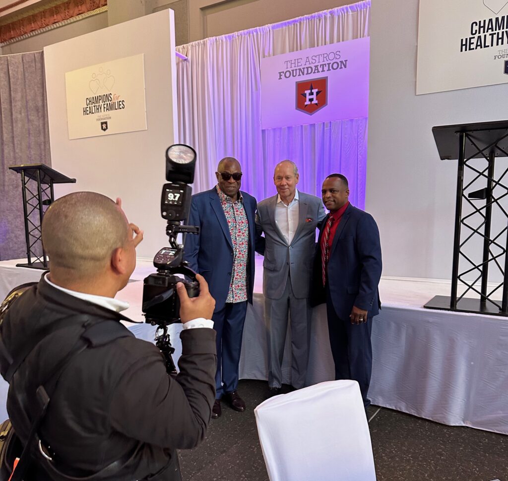 Photographer Daniel Ortiz photographs Dusty Baker, Jim Crane, Dana Brown (Photo by Shelby Hodge)