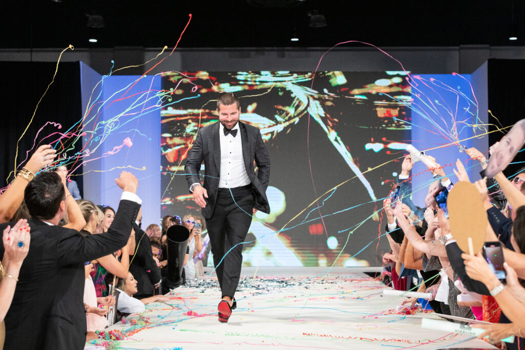 Community Champion Will Bonilla got showered with confetti during his runway walk.