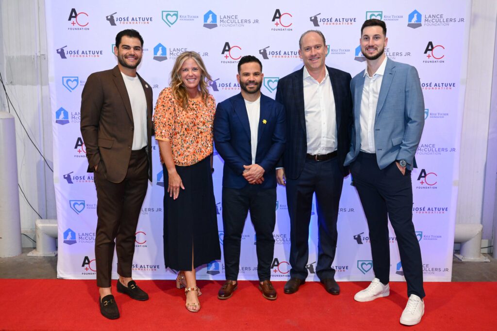 Melissa & Dan Sugulas get a thrill being photographed with Lance McCullers, Jose Altuve, and Kyle Tucker. (Photo by Michelle Watson)