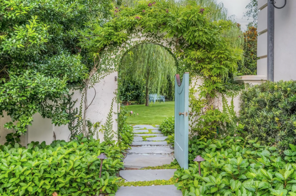 A storybook entrance to the verdant backyard at 3630 Willowick in River Oaks. (Photo by Patrick Bertolino for Martha Turner Sotheby’s International Realty)