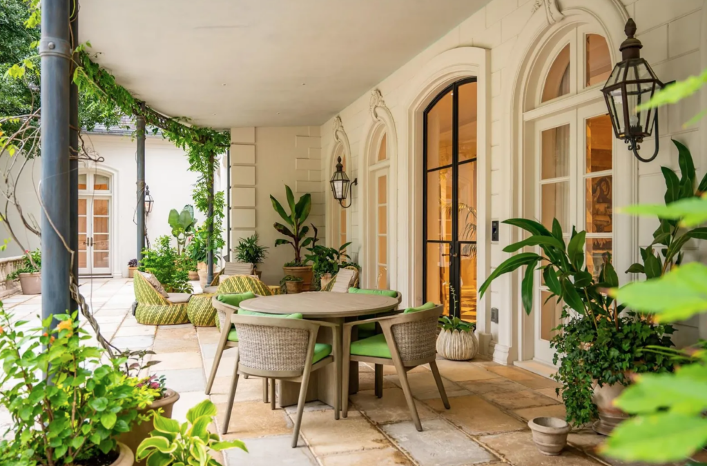 The covered patio overlooks the verdant acreage at 3630 Willowick in River Oaks. (Photo by Patrick Bertolino for Martha Turner Sotheby’s International Realty)