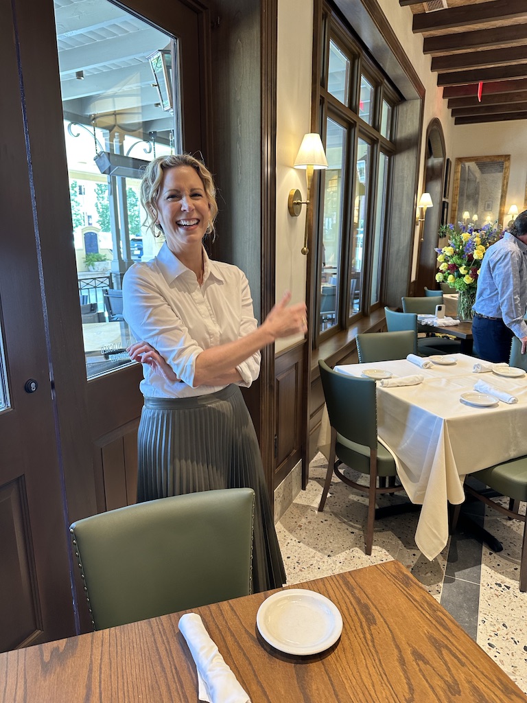 Interior designer Courtney Hill Fertitta enjoys the moment of the reveal of her work on two party rooms at Carrabba's on Kirby. (Photo by Shelby Hodge)