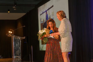 Jennifer Sanchez, left, and MG Tindall took the stage after Sanchez told the story of her daughter’s 10 years at the ranch. (Photo by Gerri Francis)