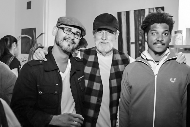 Artists Patrick Medrano and Angelbert Metoyer flank Wayne Gilbert. 