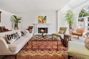 412 Hazelwood – arched windows add to the drama of the cozy formal living room.