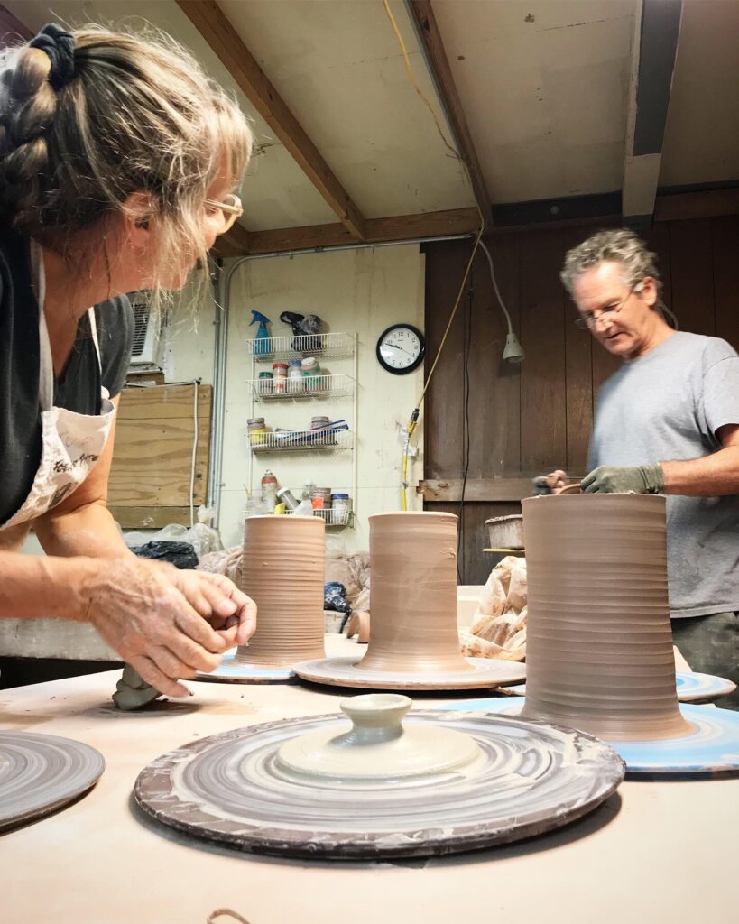 Judy Adams and John Foelber, owners of Foelber Pottery Gallery and Studios, work in their pottery studio. (Courtesy Foelber Pottery Gallery and Studios)