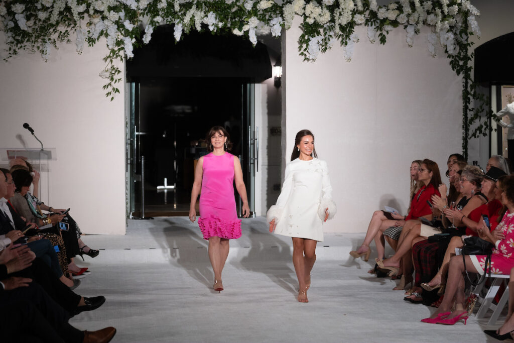 Mother/daughter LaRanda Burke, Chloe Burke on the runway at the Elizabeth Anthony Go Red for Women fashion event. (Photo by Daniel Ortiz)