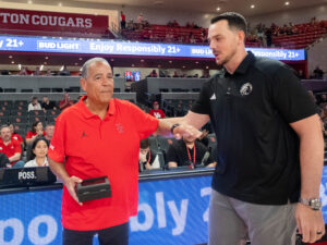 University of Houston head coach Kelvin Sampson visited with Drew Richards, head coach of the UNC Pembroke Braves, his alma mater, before an exhibition contest