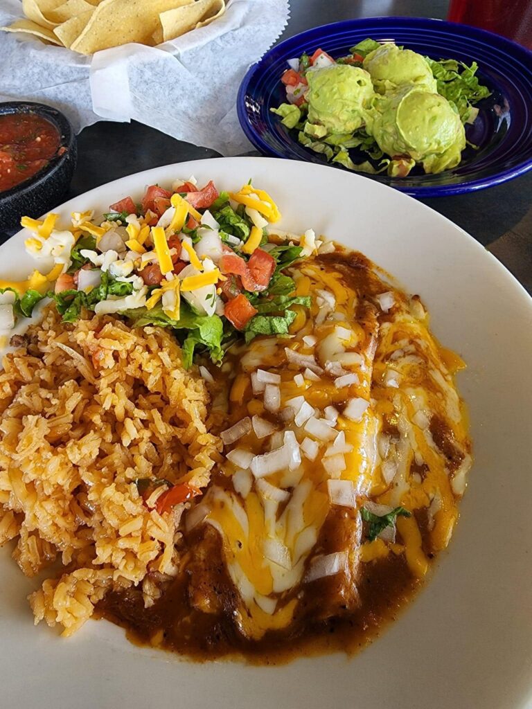 Enchilada’s Ole – fluffy rice made fresh throughout the day sides some saucy enchiladas.