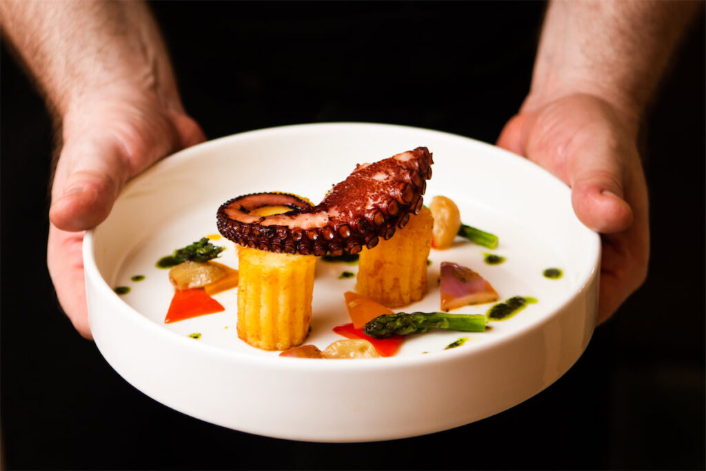 Onboard amenities include delicious cuisine.