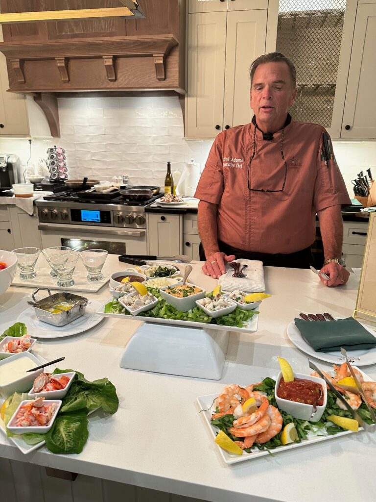 Chef Rick Adams prepares an in-home gourmet meal with wine pairings for residents of Bluejack National. (Photo by Bluejack National)